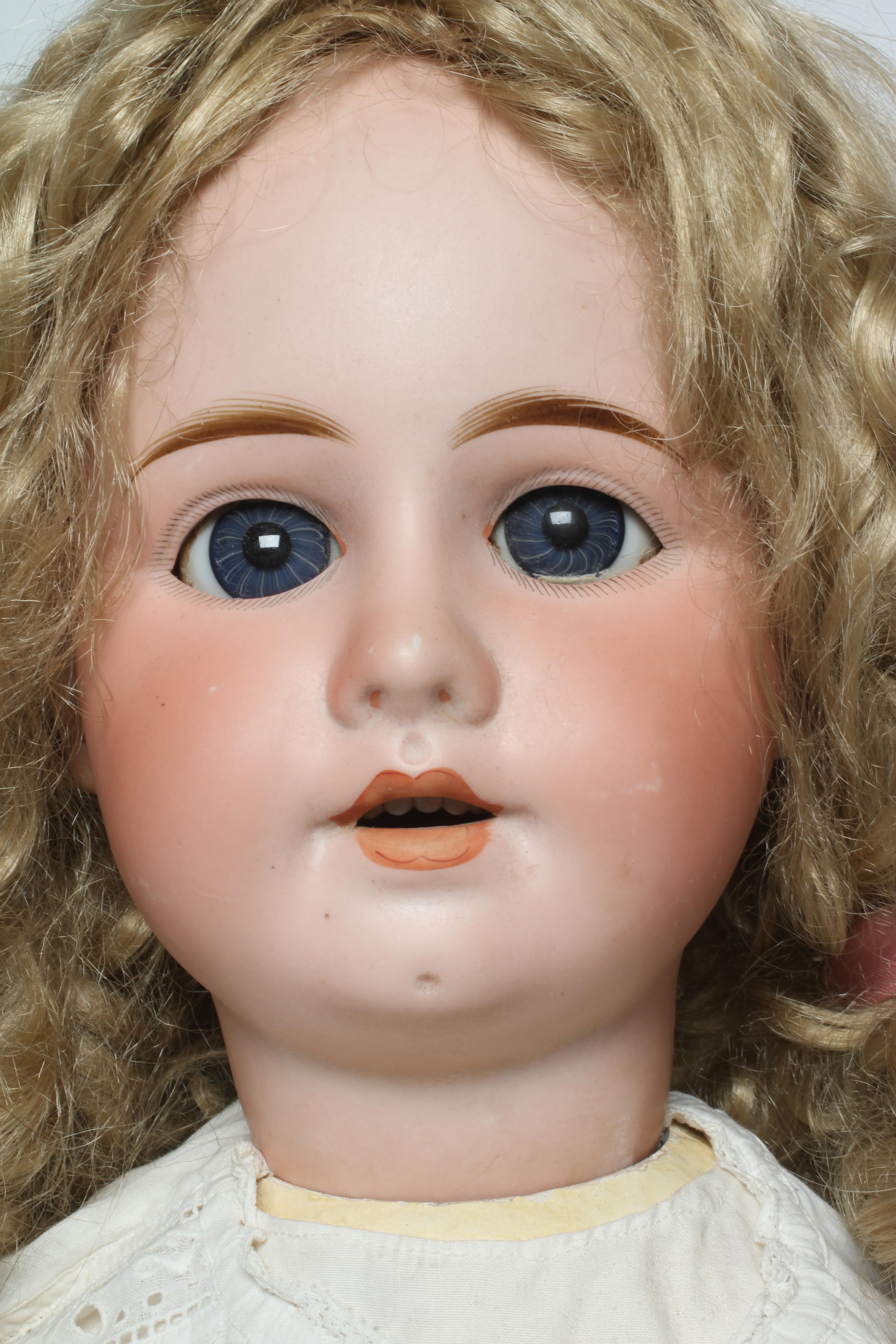 A large bisque socket head doll Image