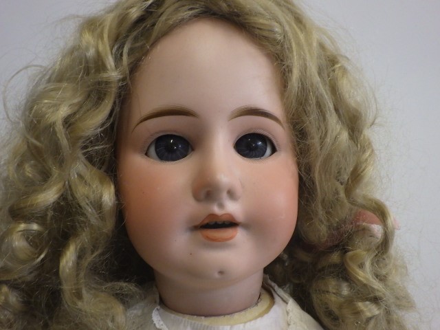 A large bisque socket head doll Image