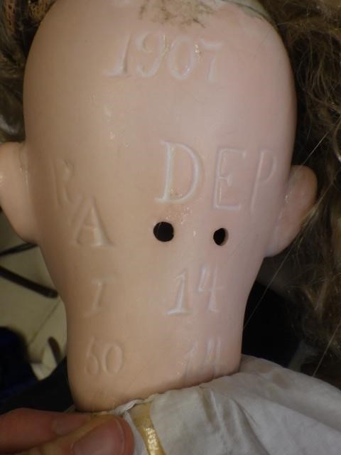 A large bisque socket head doll Image