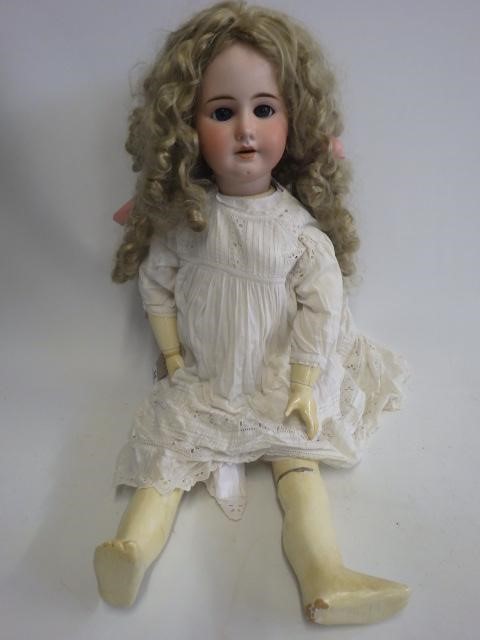 A large bisque socket head doll Image
