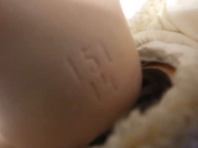 A bisque socket head character baby doll Image