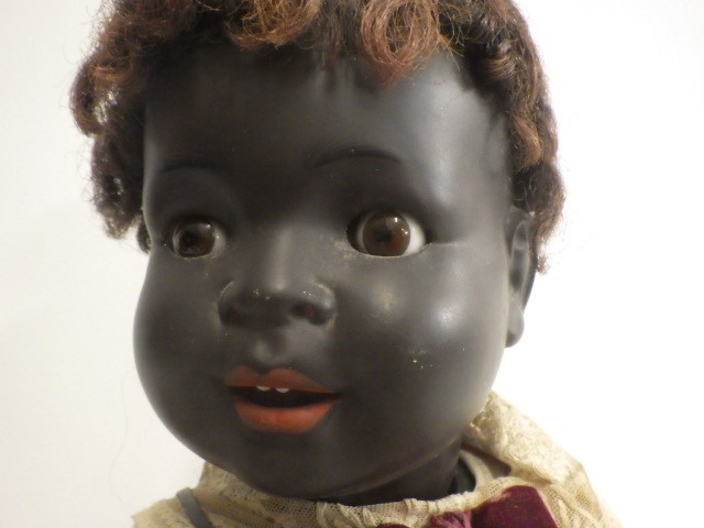 Two bisque socket head black baby dolls Image