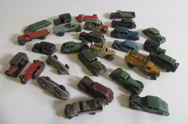 Twenty seven early playworn Dinky vehicles including Taxi cabs Image