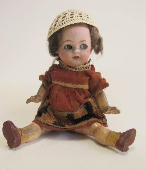 A Heubach bisque socket head flirty doll Image