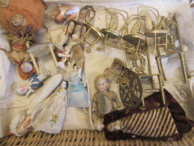 A collection of pre-war dolls house dolls Image