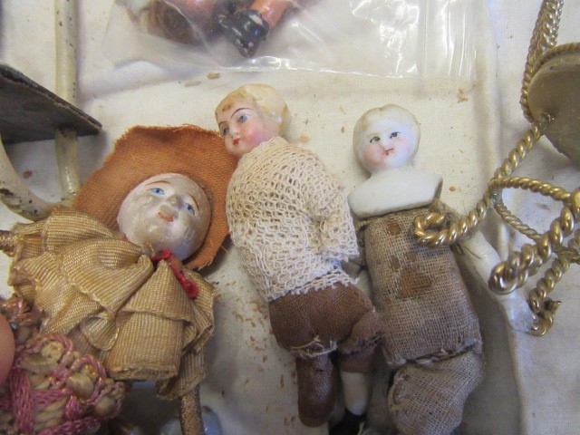 A collection of pre-war dolls house dolls Image