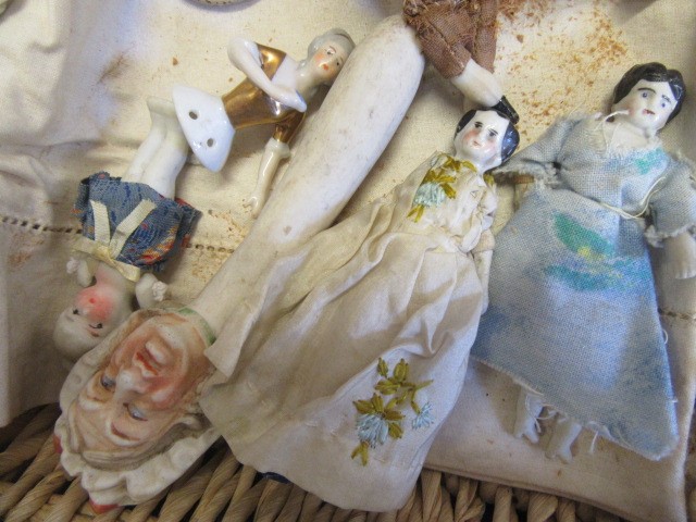 A collection of pre-war dolls house dolls Image