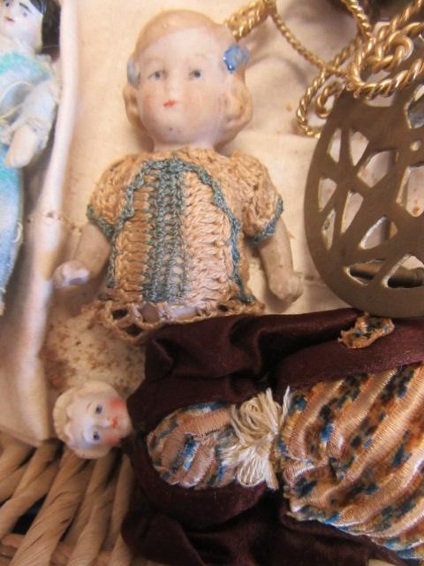 A collection of pre-war dolls house dolls Image