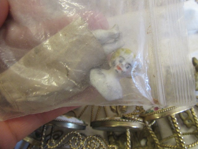 A collection of pre-war dolls house dolls Image