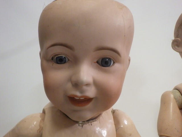 Three damaged bisque socket head dolls Image