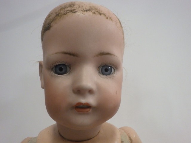 Three damaged bisque socket head dolls Image