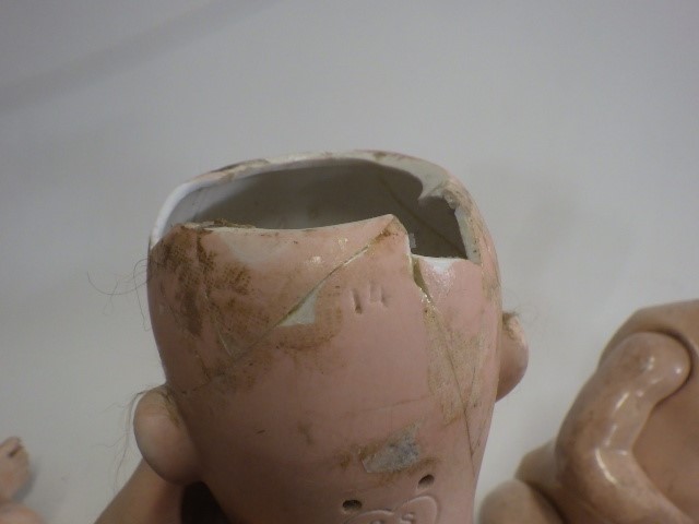 Three damaged bisque socket head dolls Image