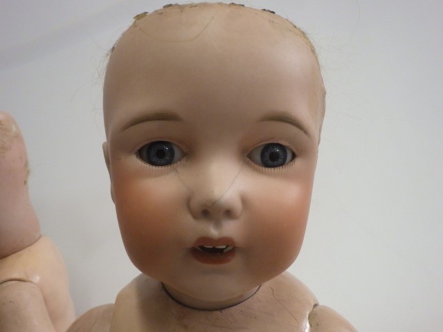 Three damaged bisque socket head dolls Image