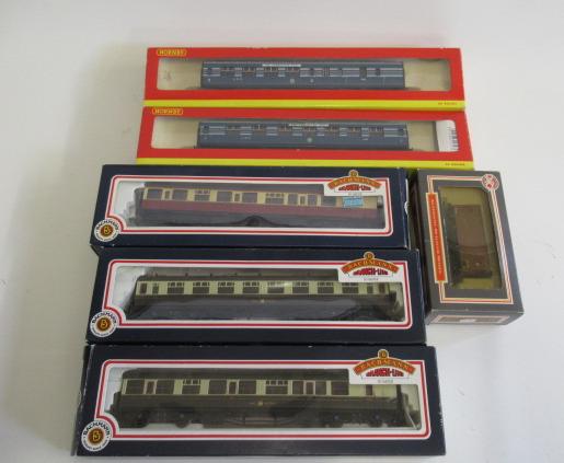Three Bachmann coaches G.W.R. and B.R. and two Hornby L.M.S. Coronation coaches Image