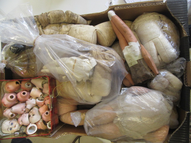 A quantity of spare doll parts including bisque heads Image