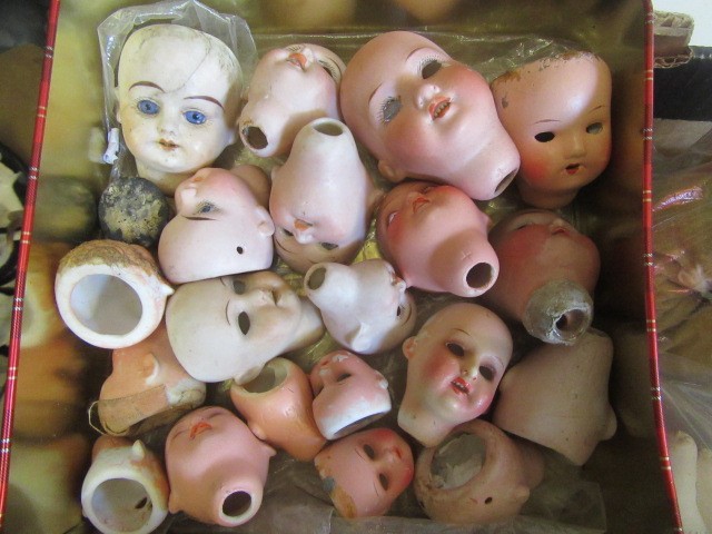 A quantity of spare doll parts including bisque heads Image