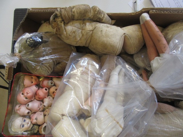 A quantity of spare doll parts including bisque heads Image