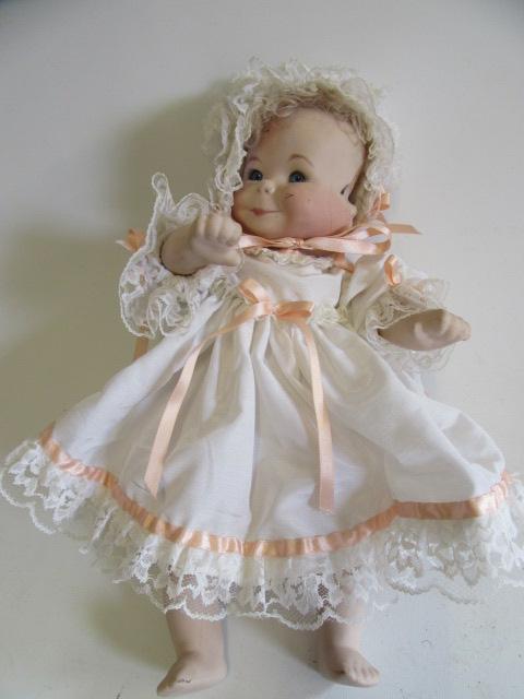 A late 20th century bisque multi-faced character doll Image