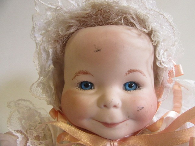 A late 20th century bisque multi-faced character doll Image