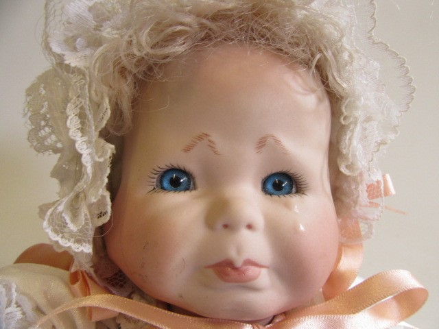 A late 20th century bisque multi-faced character doll Image