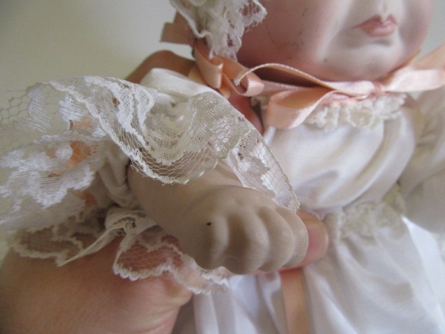A late 20th century bisque multi-faced character doll Image