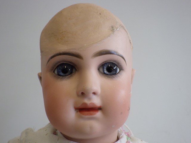 A restored French bisque socket head doll Image
