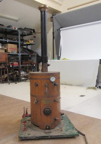 A large gas fired water boiler for steam engine with water feed pump and pressure gauge.  Please Image