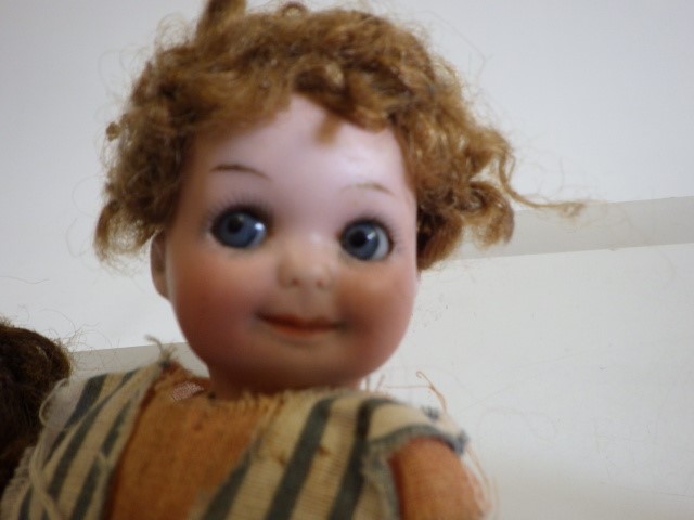 Four small bisque head dolls Image