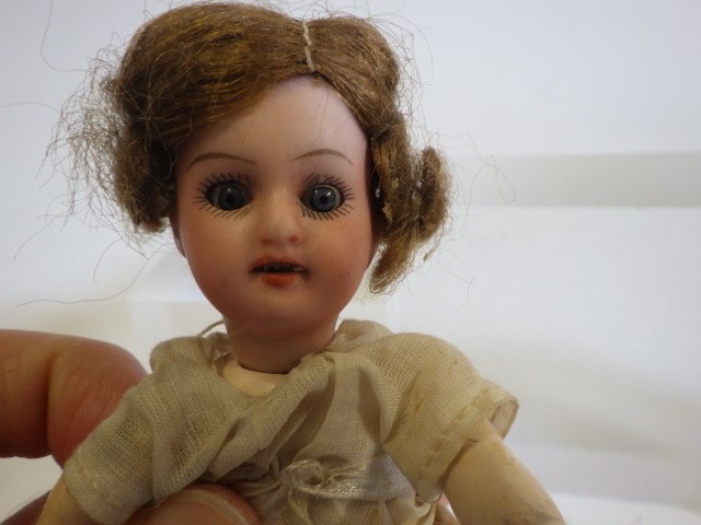 Four small bisque head dolls Image