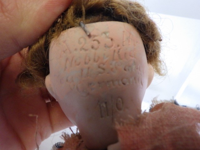 Four small bisque head dolls Image