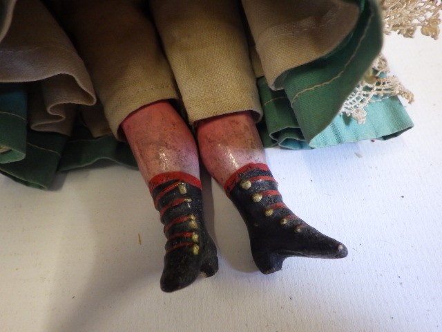 A small wax shoulder head doll Image