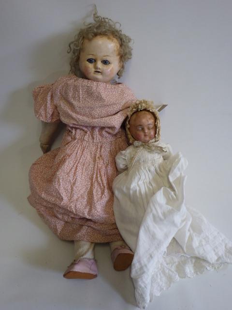 Two wax head dolls Image