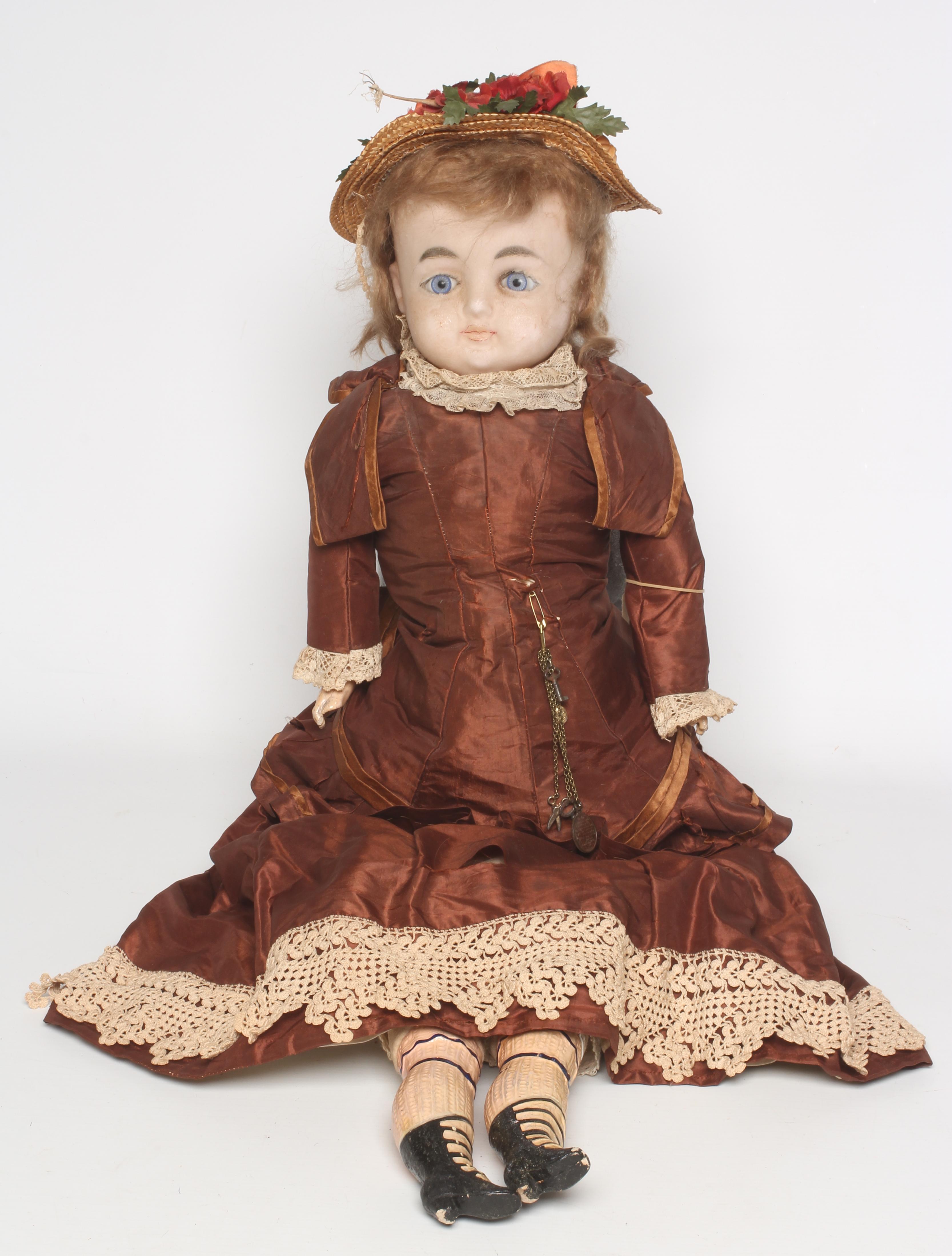 A 19th century wax shoulder head doll Image