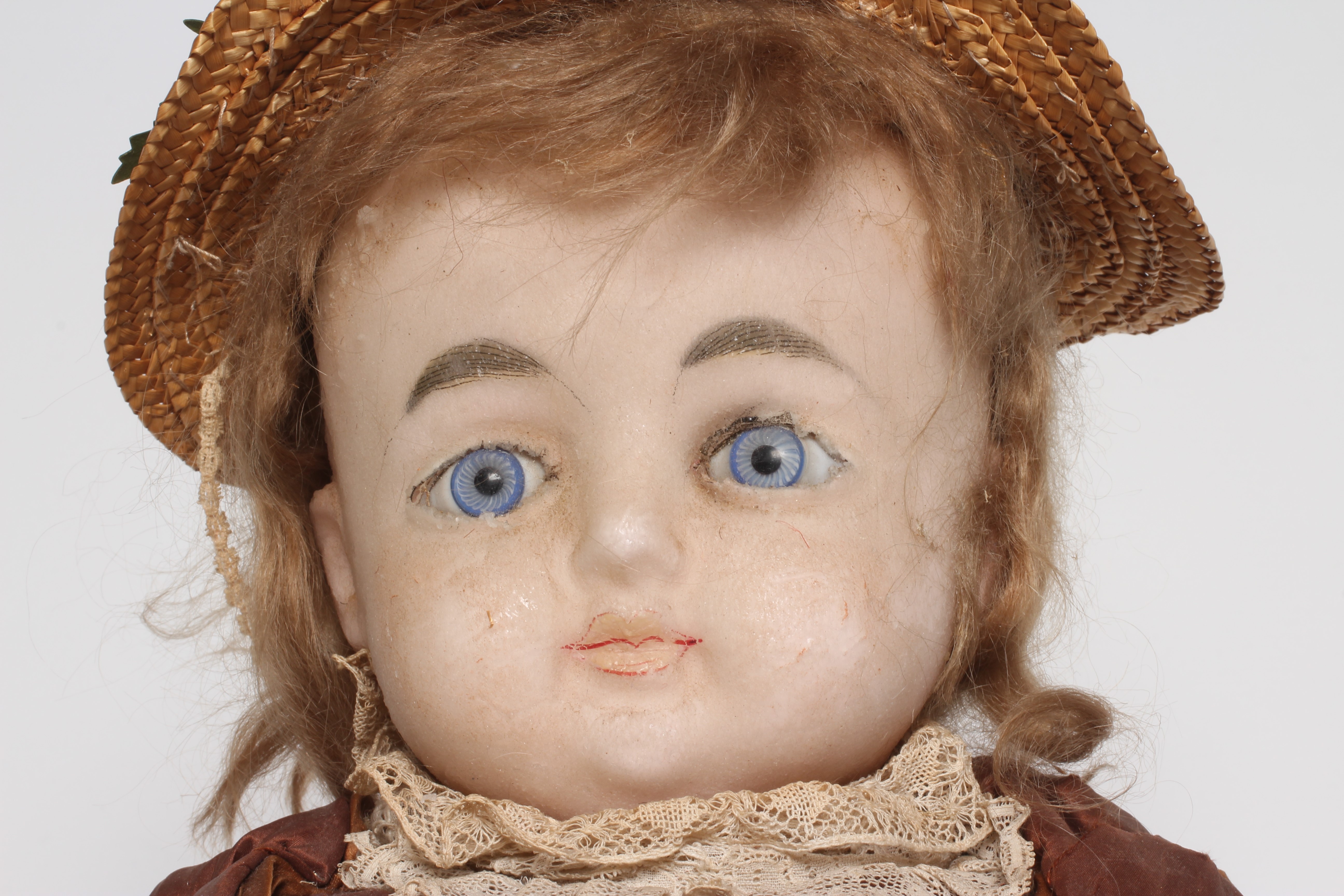 A 19th century wax shoulder head doll Image