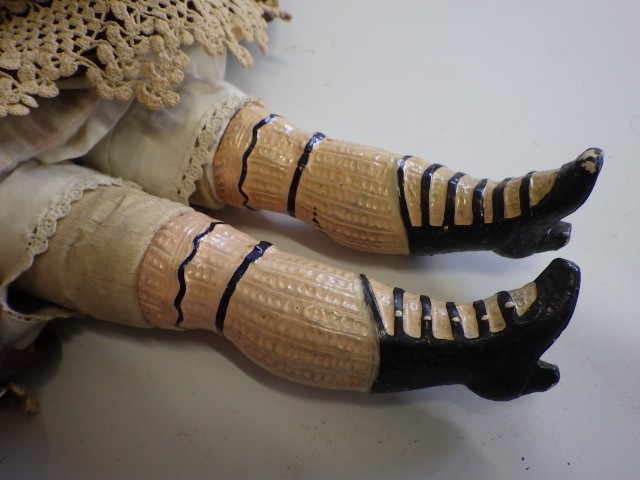 A 19th century wax shoulder head doll Image