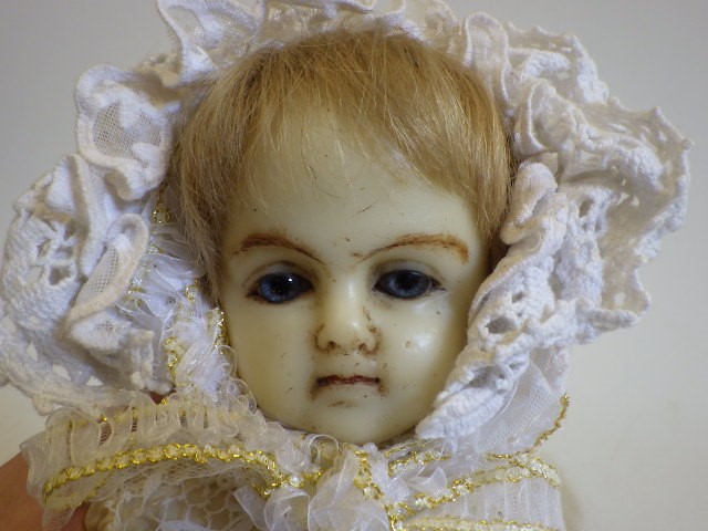A wax shoulder head doll Image