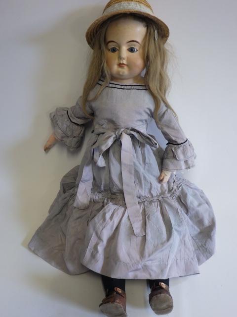 A 19th century composition shoulder head doll Image