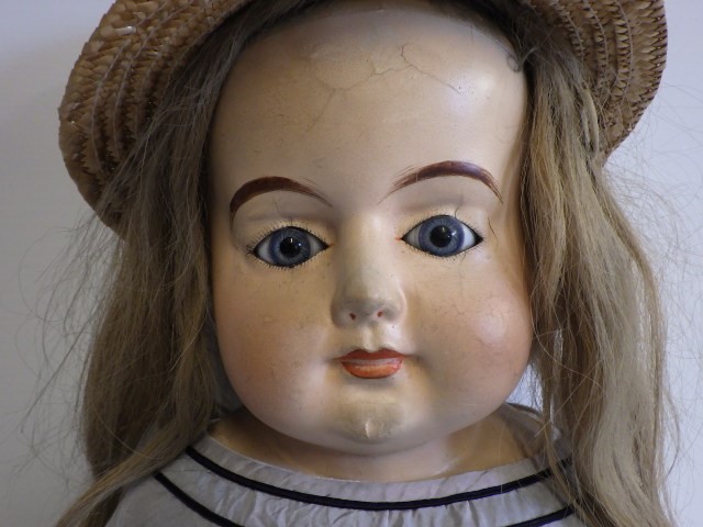 A 19th century composition shoulder head doll Image