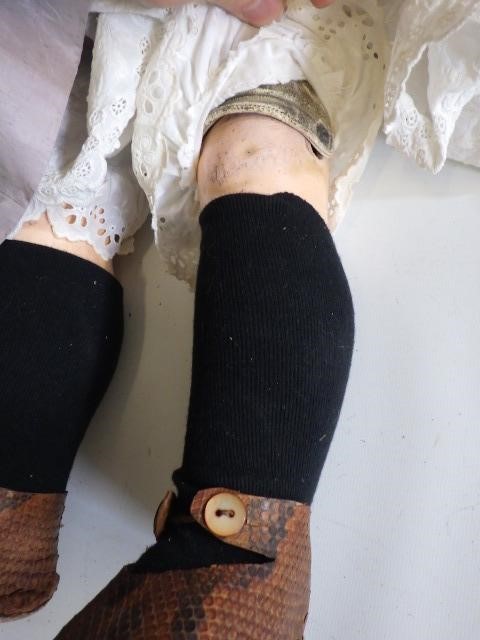 A 19th century composition shoulder head doll Image