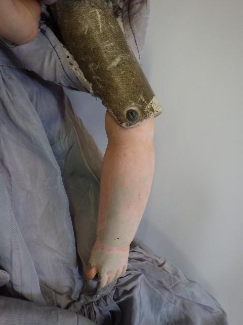 A 19th century composition shoulder head doll Image