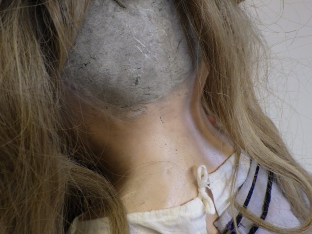 A 19th century composition shoulder head doll Image
