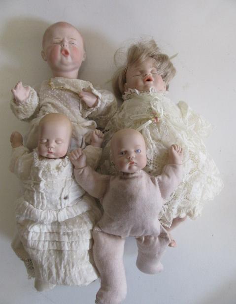 Four late 20th century bisque head dolls Image