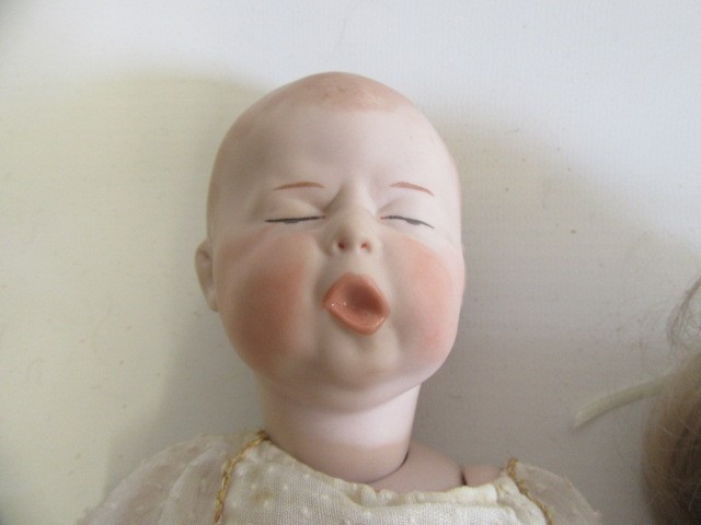 Four late 20th century bisque head dolls Image