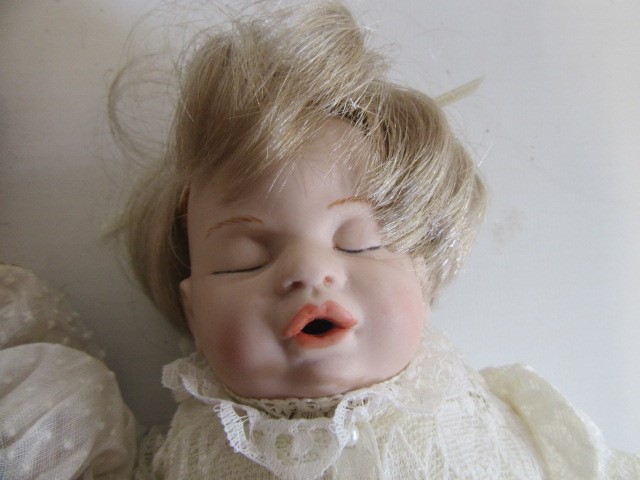 Four late 20th century bisque head dolls Image