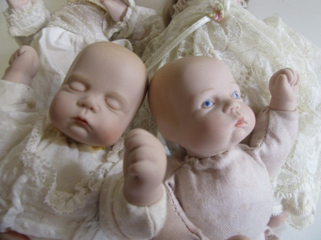 Four late 20th century bisque head dolls Image