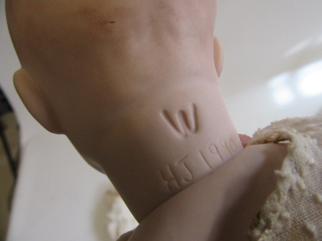 Four late 20th century bisque head dolls Image