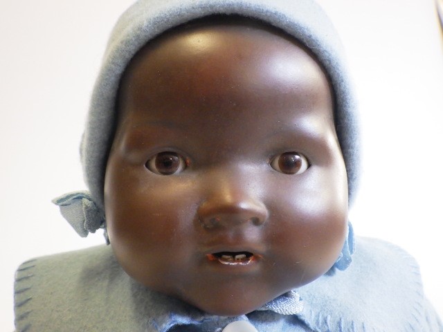 An Armand Marseille bisque socket head black baby doll Image