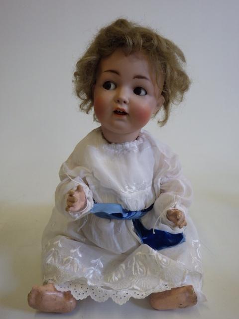 A Hertel Schwab and Co bisque socket head flirty doll Image