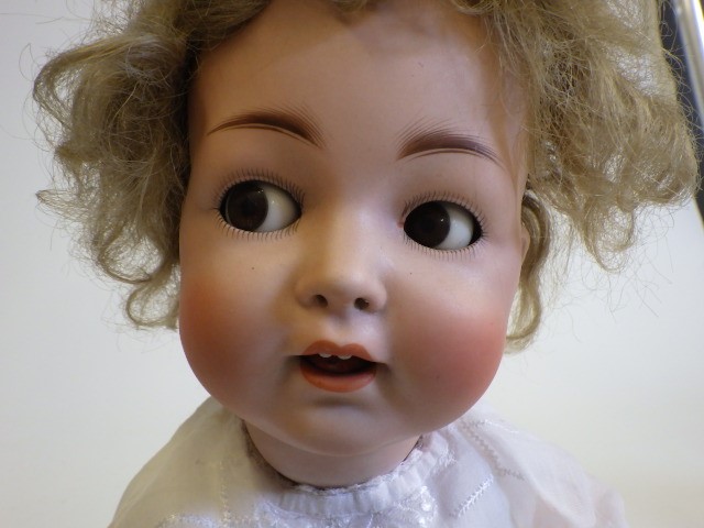 A Hertel Schwab and Co bisque socket head flirty doll Image
