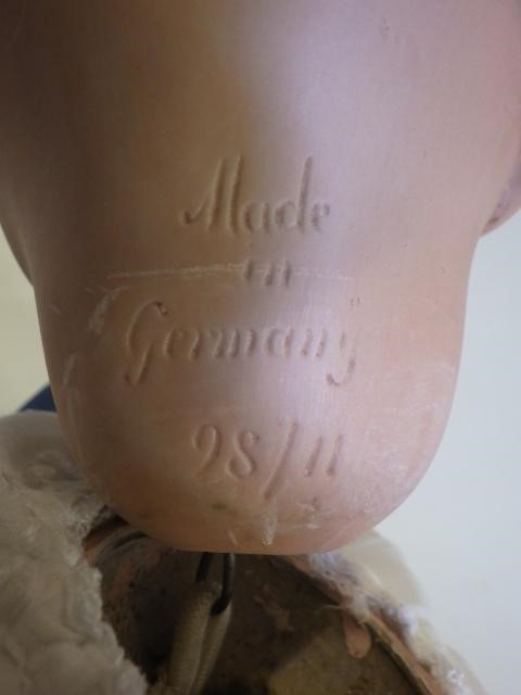 A Hertel Schwab and Co bisque socket head flirty doll Image